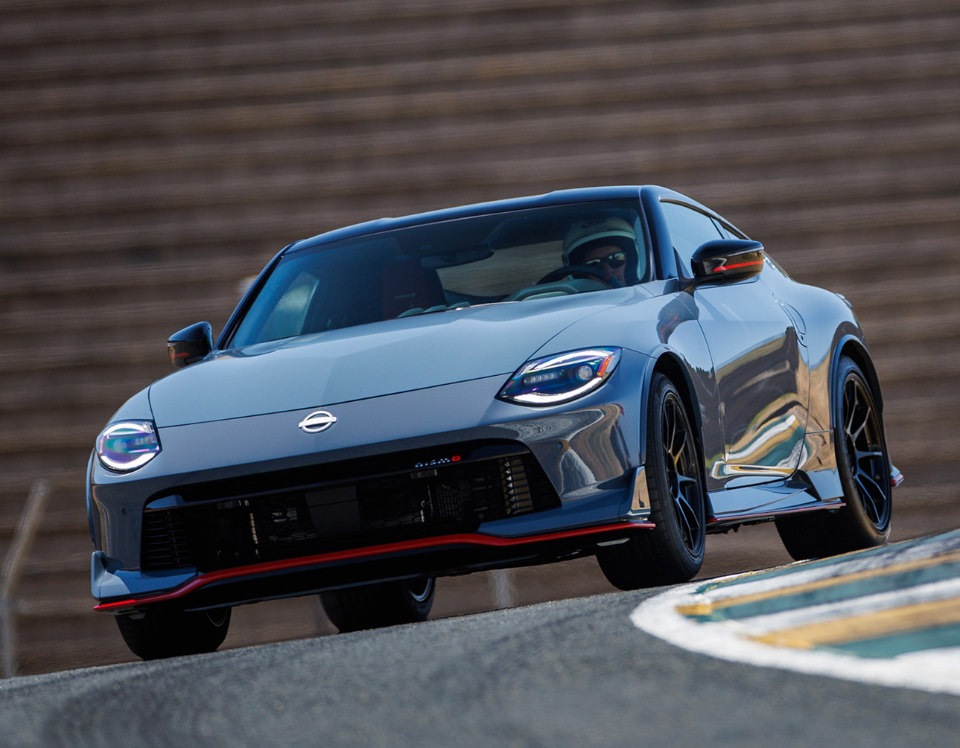 A blue, current Nissan Z on a track,