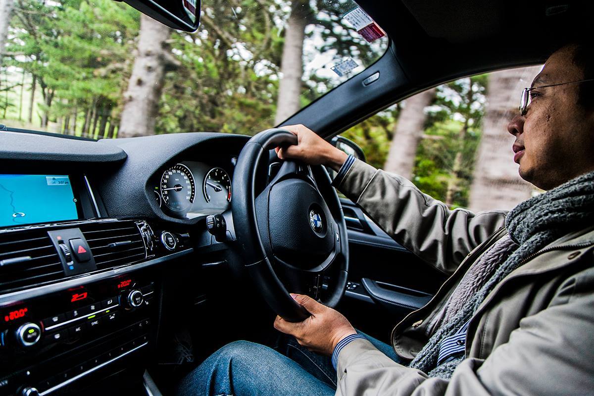 Jack Yan driving a BMW X4, photographed by Stuart Cowley.