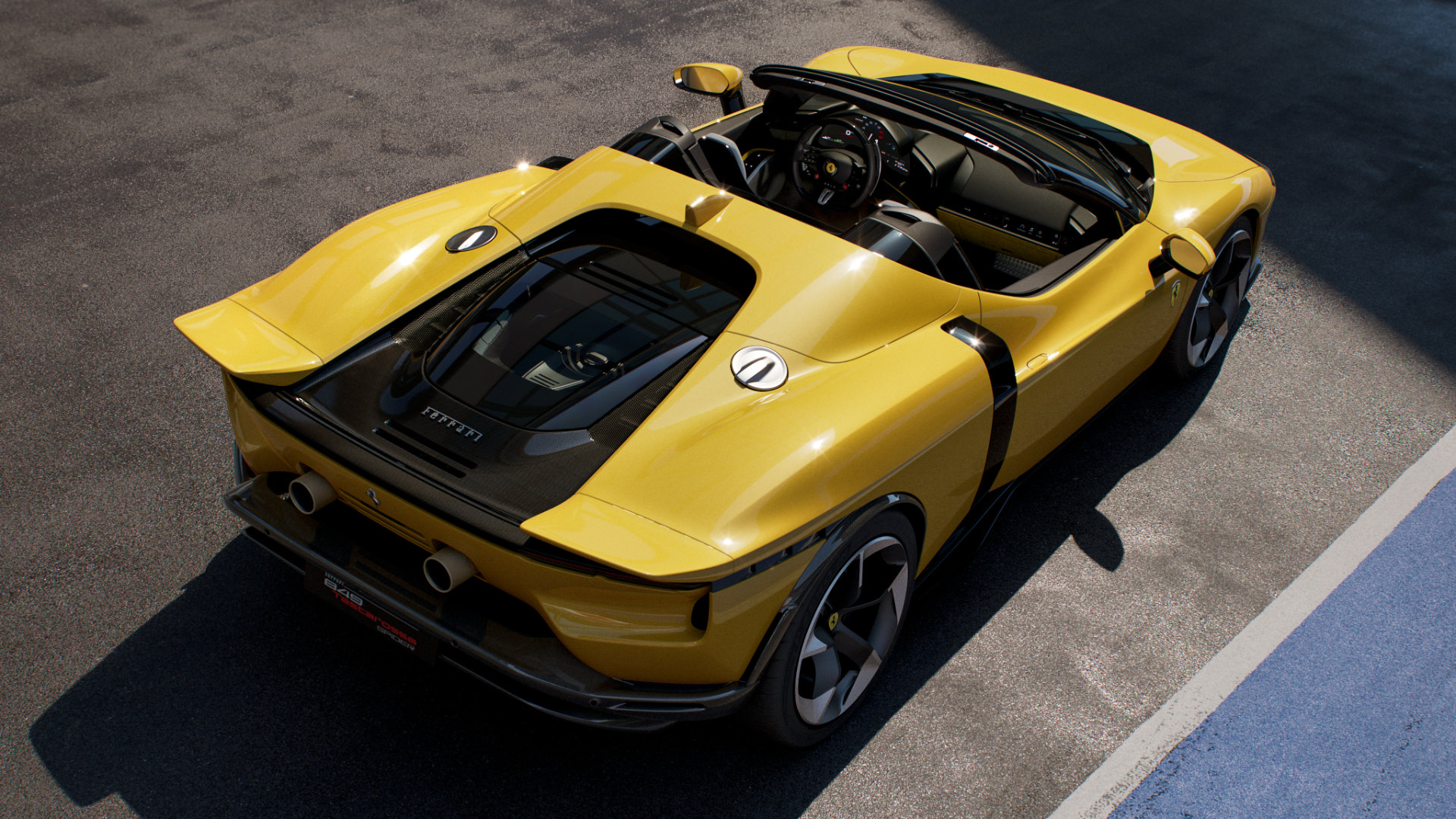 View from the rear of a yellow Ferrari 849 Testarossa Spider on a test track.